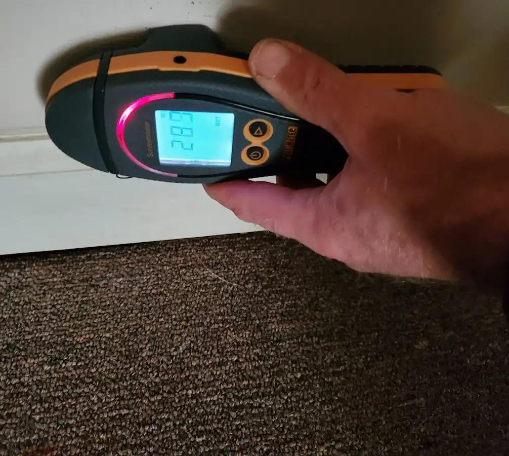 Moisture detection at baseboard during Sewage Cleanup & Sanitation in Guthrie